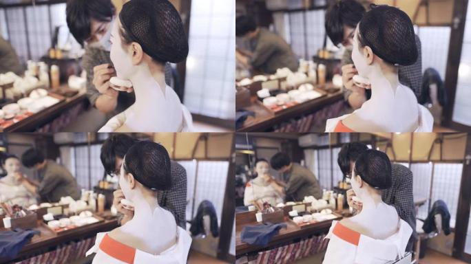 员工为客户提供特殊的 “maiko” (培训中的艺妓) 化妆