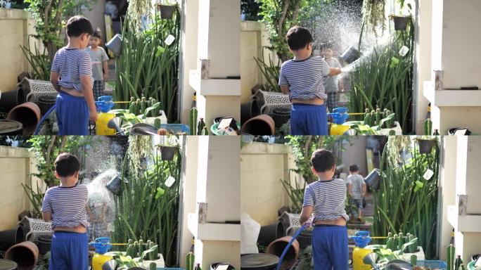 哥哥在花园里浇水很开心