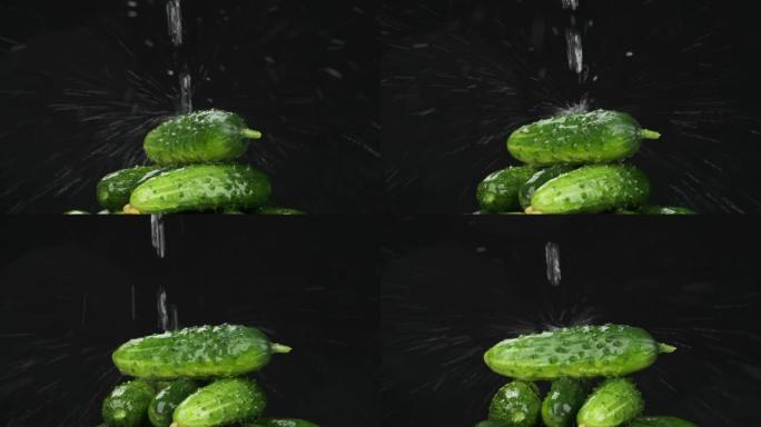 慢动作。水流落在一堆成熟的旋转的黄瓜上。