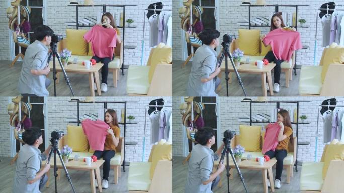 年轻的亚洲夫妇博主录制vlog视频，有影响力的人在工作室的社交媒体上在线展示和销售服装，在线学习教程