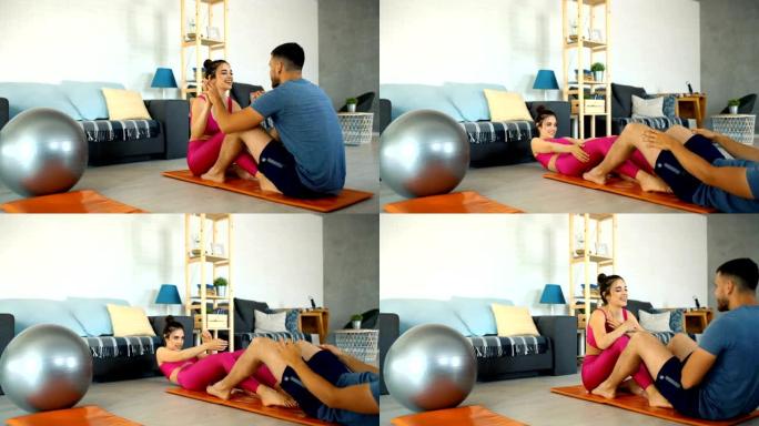 夫妇在家锻炼。外国人情侣在家锻炼身体视频