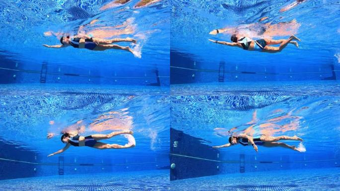 女子泳池自由式游泳的水下轨迹视图穿两件套泳衣