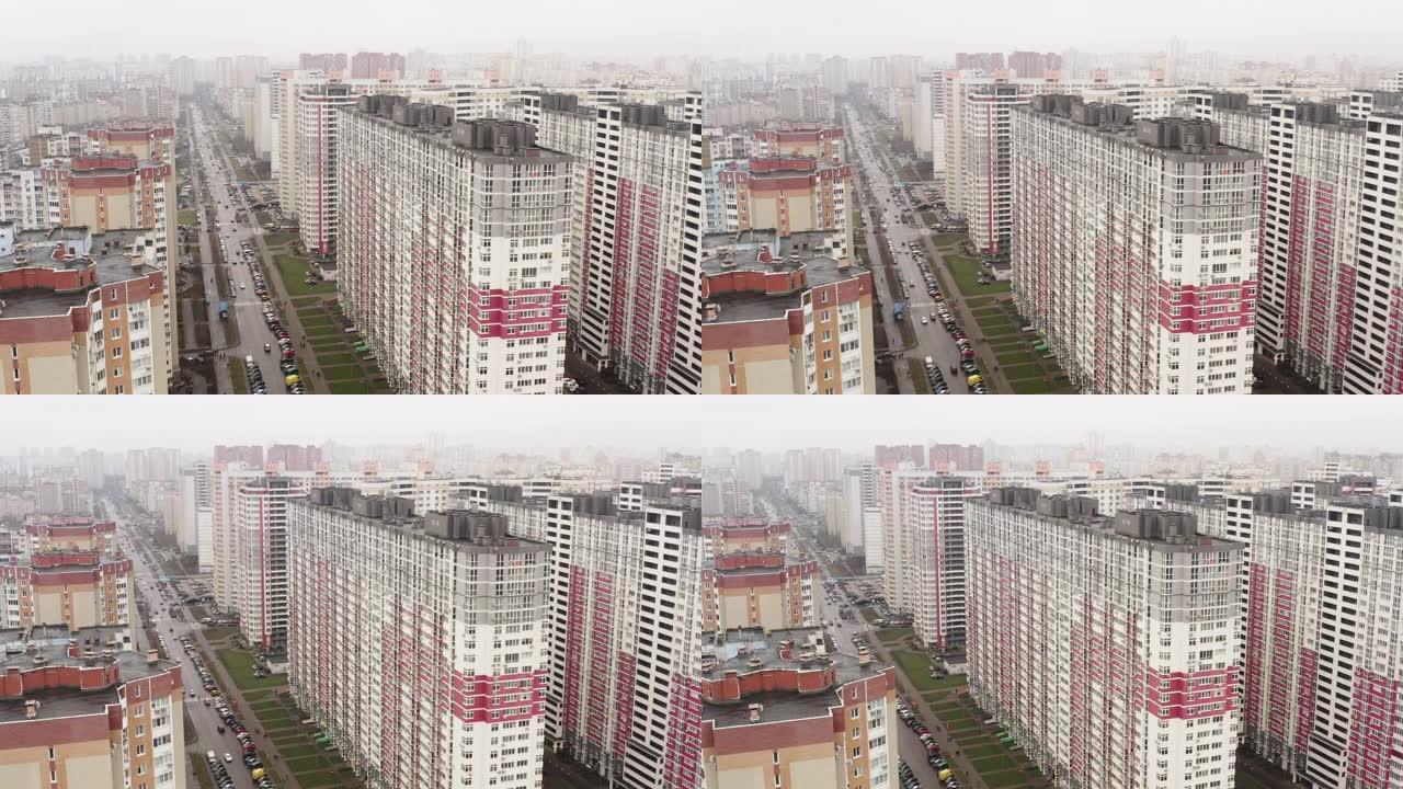 鸟瞰图。一个在阴天的冬日里有高层建筑和公寓的城市。基辅全景。大都市住宅区的多层建筑。城市化。城市总体