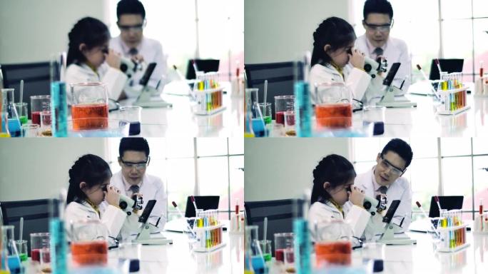 亚洲小女孩在科学学习室，快乐的智利，微笑在科学室。