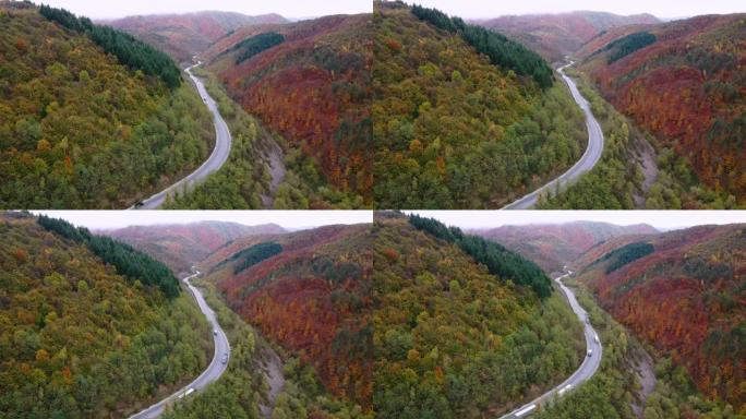 秋季天线。秋天，空中公路穿越蜿蜒的山路，汽车驶过五颜六色的森林。