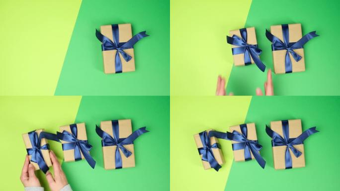 女性手戴上绿色表面包裹的礼物，蓝色系结丝带