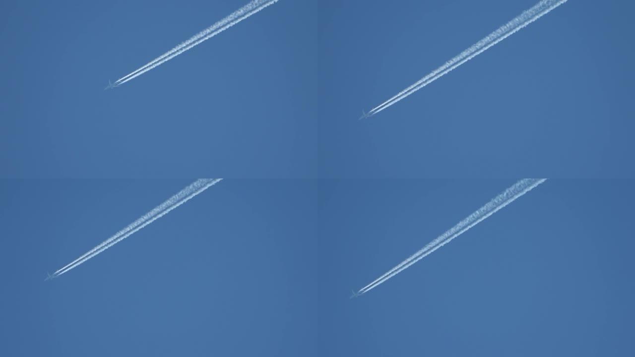 喷气式客机在高空飞行，在湛蓝的天空中留下凝结尾迹
