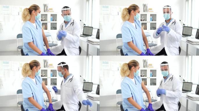4k视频: 医生穿防护服给医务人员注射新型冠状病毒肺炎疫苗