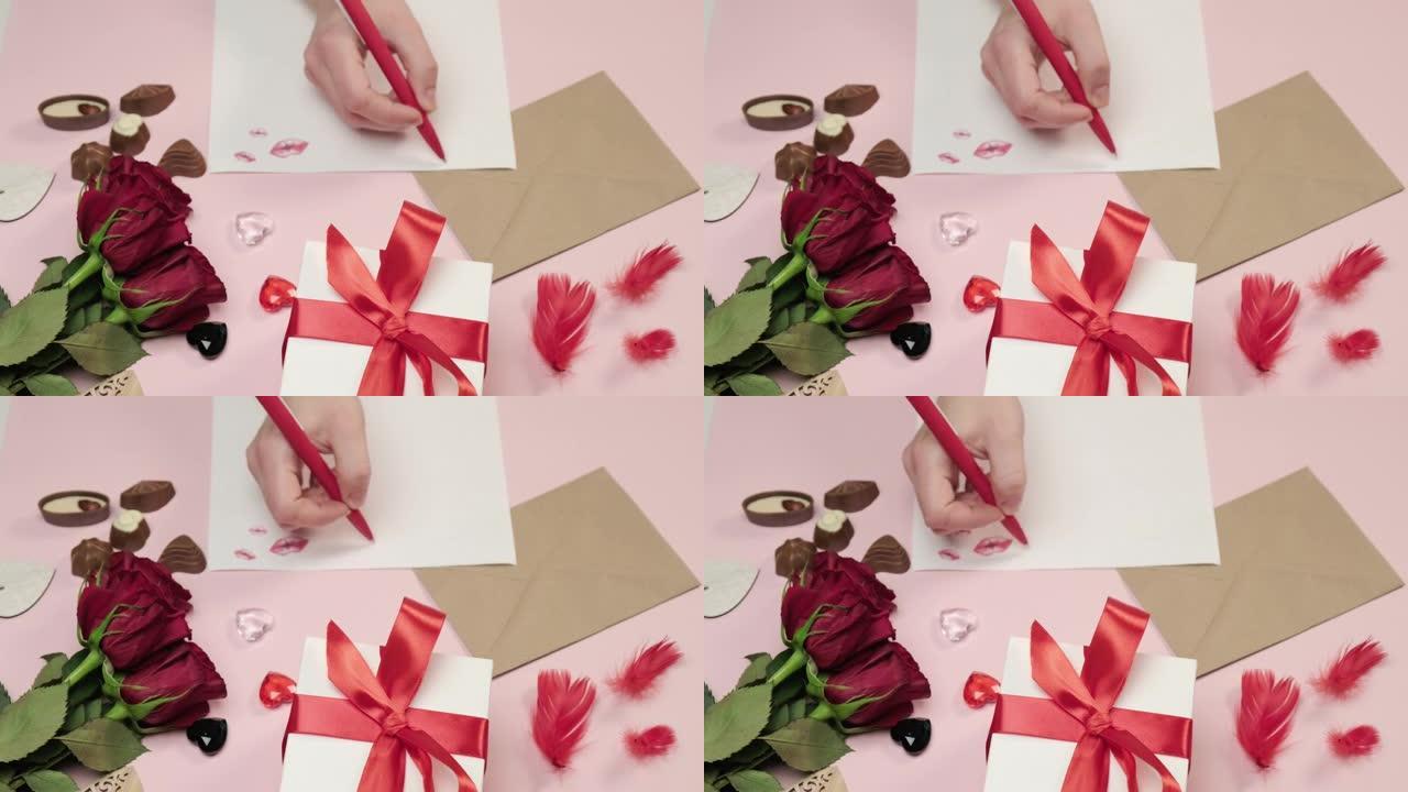 女人的手用笔在纸上写一封情书。粉色背景。