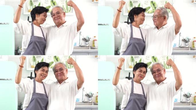 亚洲高级已婚夫妇在厨房做饭。70多岁的男女在厨房柜台一起准备食材