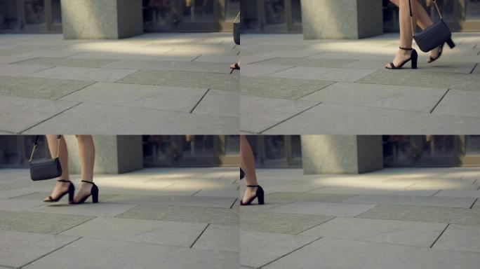 穿着高跟鞋的女人走路的腿