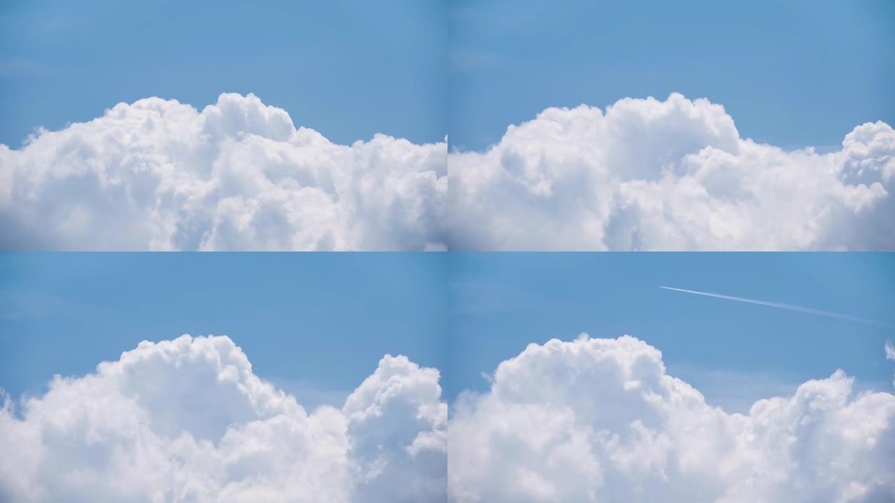 4k延时白色云堆在明亮的蓝色夏季天空中改变形态
