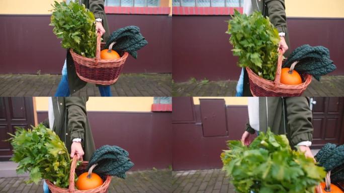 女人手里拿着篮子蔬菜。新鲜食物送回家。