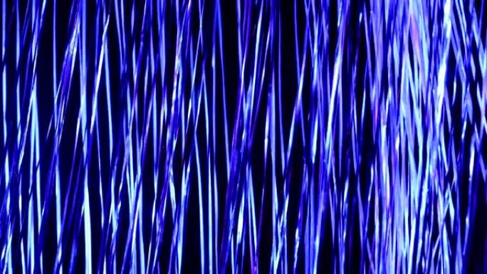 抽象背景视频，花环弦随风移动，带蓝色灯光。