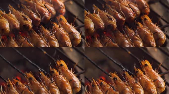 传统炉子上的烤虾。只有用串烧的头才能通过。泰国和夏季的海鲜菜单。市场，街头食品。宏观拍摄。