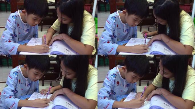 兄弟姐妹一起在家做作业。