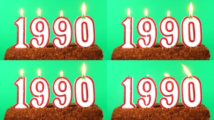 蛋糕与数字1990点燃的蜡烛。上个世纪的日期。色度键。绿屏。隔离