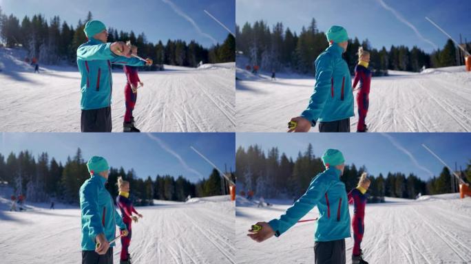 男滑雪教练向他的客户解释如何在滑雪坡上使用滑雪杆进行锻炼