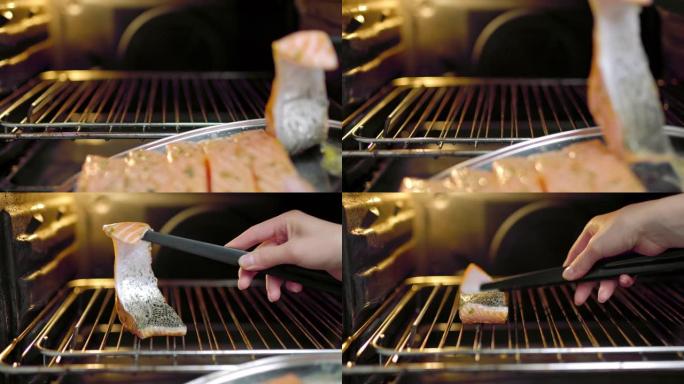 女人的手正在将生鲑鱼片放在烤箱的烤架上。高温烹饪鲑鱼的概念，鲑鱼开始烧烤。