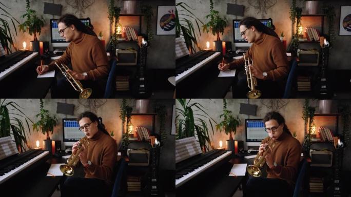 年轻的音乐家在他的家庭办公室工作室创作歌曲