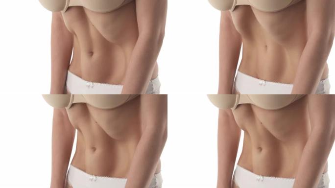 一个女人的肚子做胃真空呼吸运动的特写镜头。