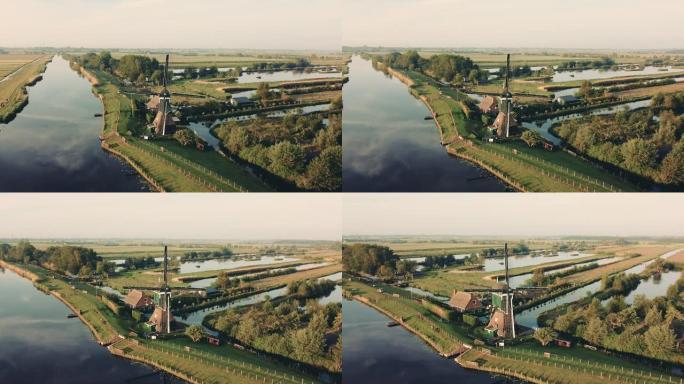 荷兰日落时传统风车的鸟瞰图。无人机镜头