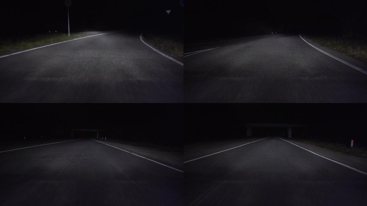 黑暗中高速公路上行驶的汽车的镜头