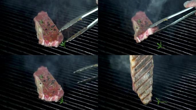 厨师使用tong并在烤架上转动线状牛肉尖。