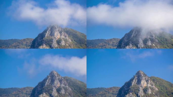 4 k分辨率定时拍摄的岩石上的山和云。