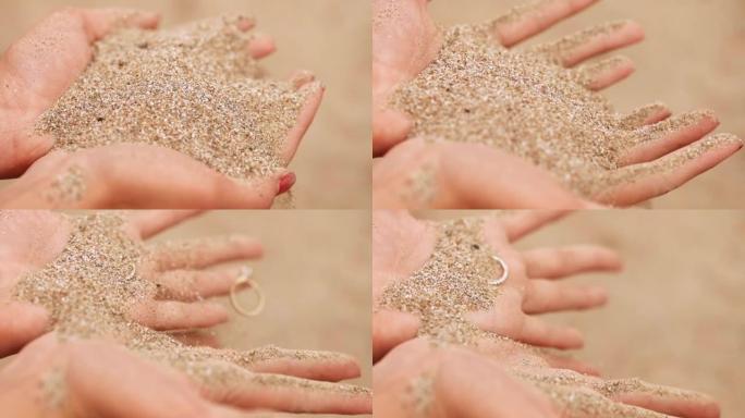 沙子滑过男人的手指