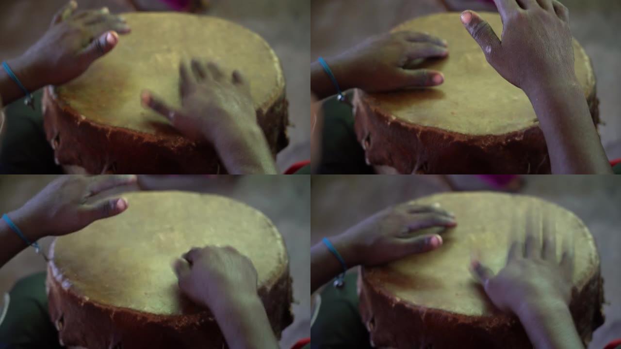 音乐家演奏ngoma鼓的手，桑给巴尔，坦桑尼亚，非洲