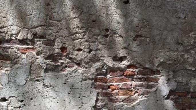 4k自然裂缝和纹理砖水泥墙上的抽象移动阴影与微风
