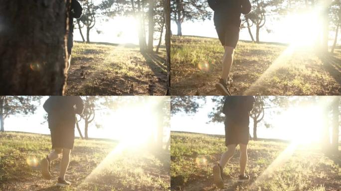自信的人在日落时在森林里奔跑。健康生活方式理念