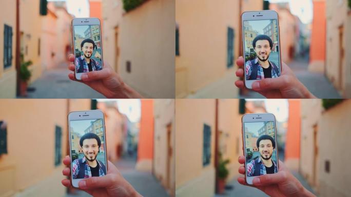 男子在智能手机上进行视频通话的特写镜头