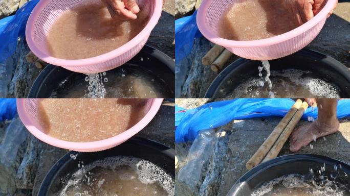渔民用清水清洗和过滤新鲜的磷虾或负鼠虾