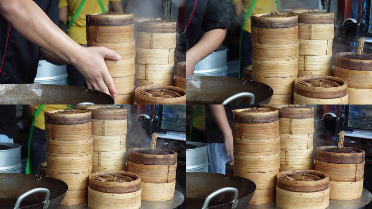 厨师手动竹制点心篮烹饪着名的中式早餐餐