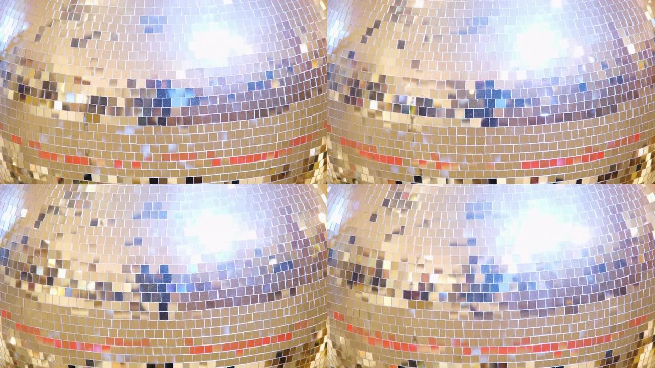 明亮的大型金色迪斯科球特写4k分辨率视频旋转复古迪斯科球背景