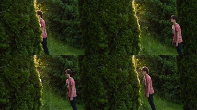 绿色郁郁葱葱的花园青少年男孩中的定格动画