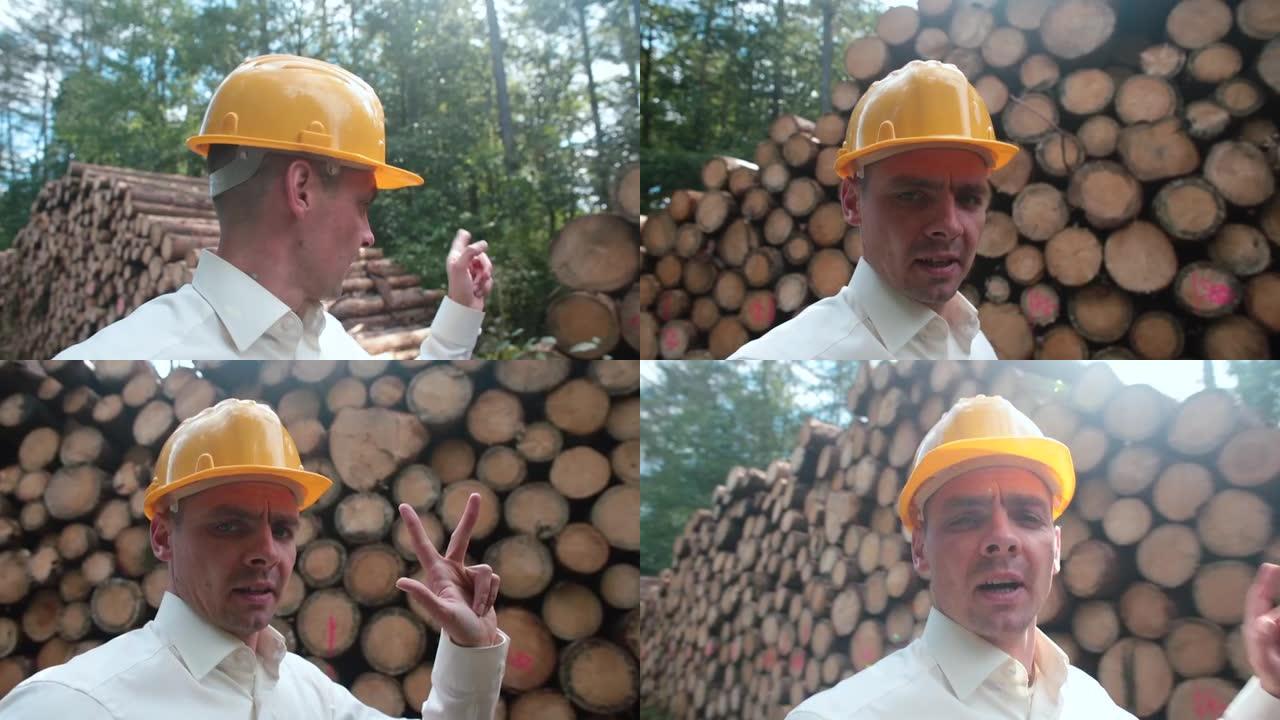 一个博客作者，一个戴着建筑头盔的人，谈论森林砍伐。