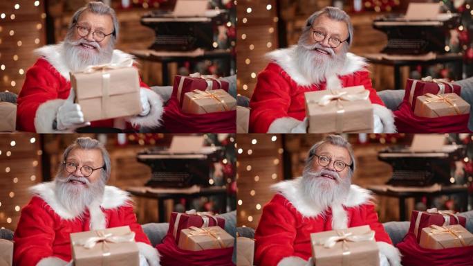 圣诞老人赠送包装礼盒祝贺节日。4k红色相机上的中特写镜头