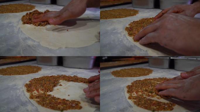 在石烤箱中烘烤lahmacun，黎凡特的传统食品