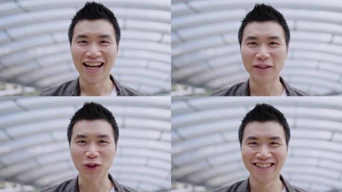 亚洲男人的特写脸正在说话或微笑着介绍一个快乐。良好的友谊。面部皱纹根据年龄和良好的牙齿健康。概念积极