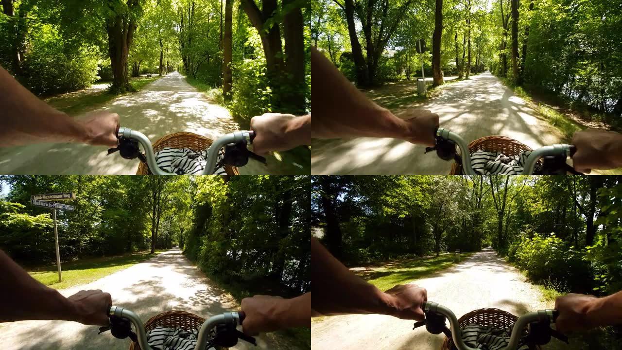 男子骑着折叠自行车穿过公园