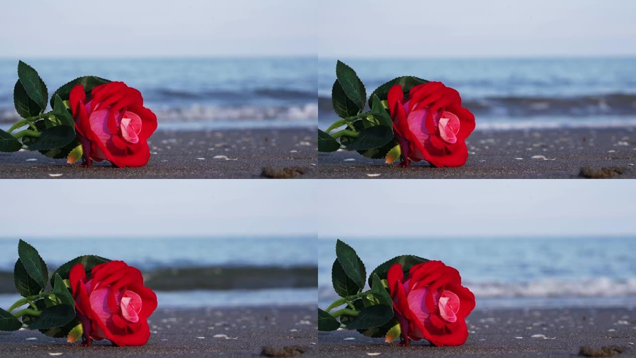 织物制成的人造玫瑰花躺在波浪中