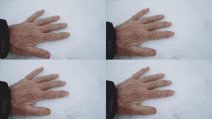 男子在雪地上留下手印