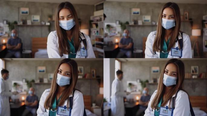 年轻的女医生用口罩摆姿势拍照