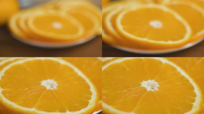 盘子上切成薄片的橙色柑橘类水果，特写镜头，缩放运动