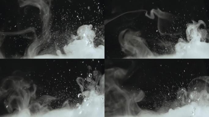 飞溅，飞溅，滴落和飞溅的水与蒸汽close-up.Slow-motion视频，具有循环的能力。旋转，