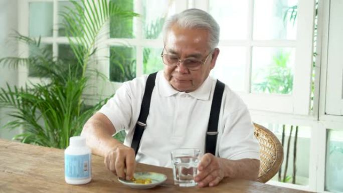 亚洲老人服用药丸吃药降压药鱼油