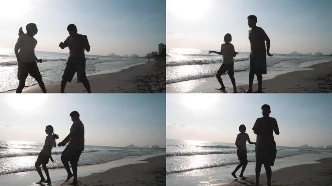 剪影亚洲儿童在泰国华欣度假期间早上在海滩上跳舞。